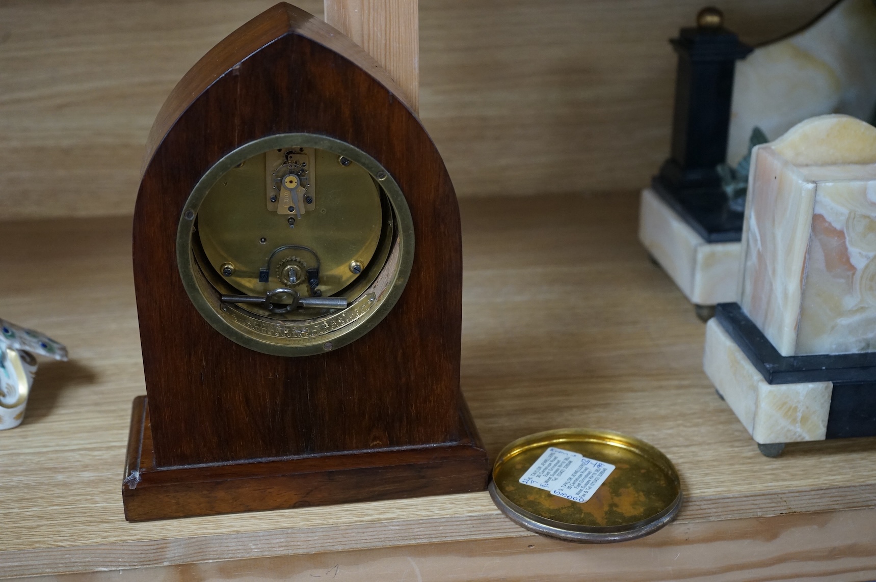 An Edwardian inlaid mahogany lancet shaped eight day mantel timepiece, with key, 23cm high